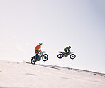 Sports, jump and people on motorcycle driving on sand, beach or training for a challenge, competition or desert rally. Dirt, motorbike and men in fearless extreme sports, stunt or jumping in the air