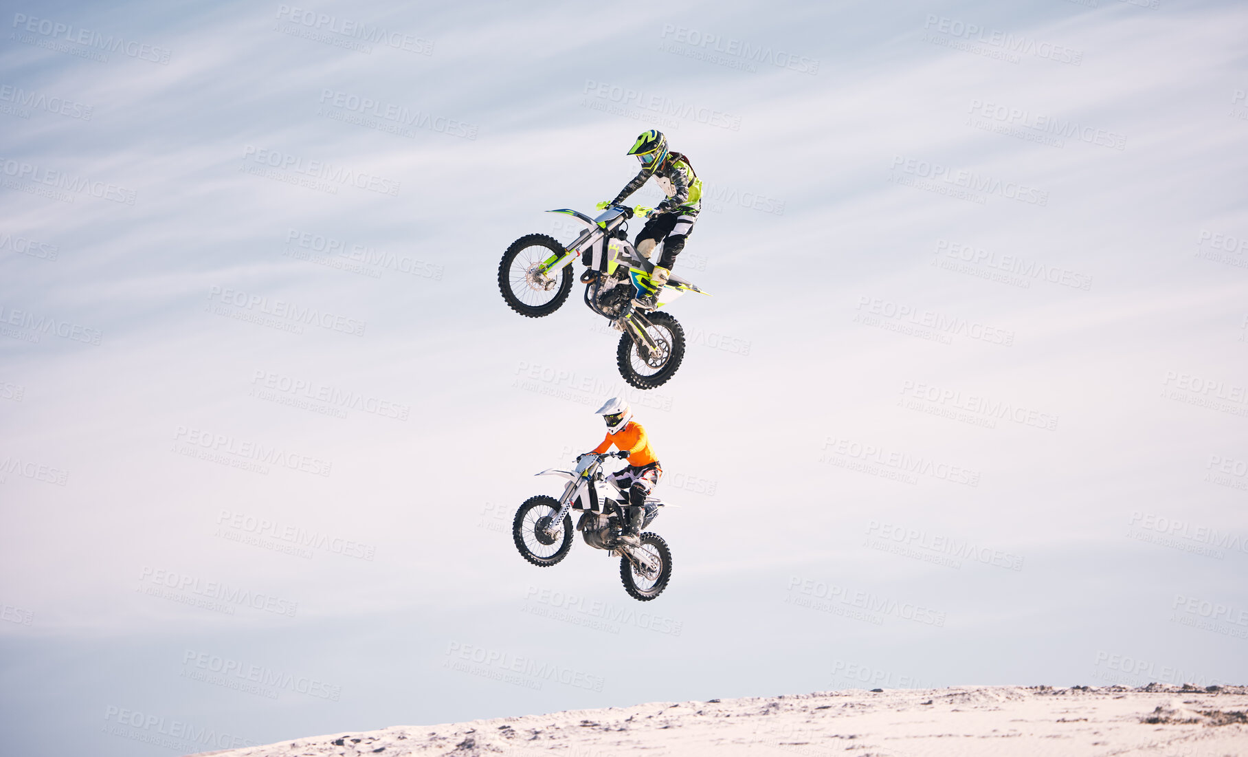 Buy stock photo Sports, jump and people on motorcycle driving on sand, beach or training for a challenge, competition or desert rally. Dirt, motorbike and men in fearless extreme action, stunt or jumping in the air