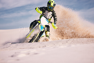 Buy stock photo Motorcycle, dust and energy with a sports man riding a vehicle in the desert for adventure or adrenaline. Bike, freedom and training on sand with an athlete outdoor in nature for power or competition