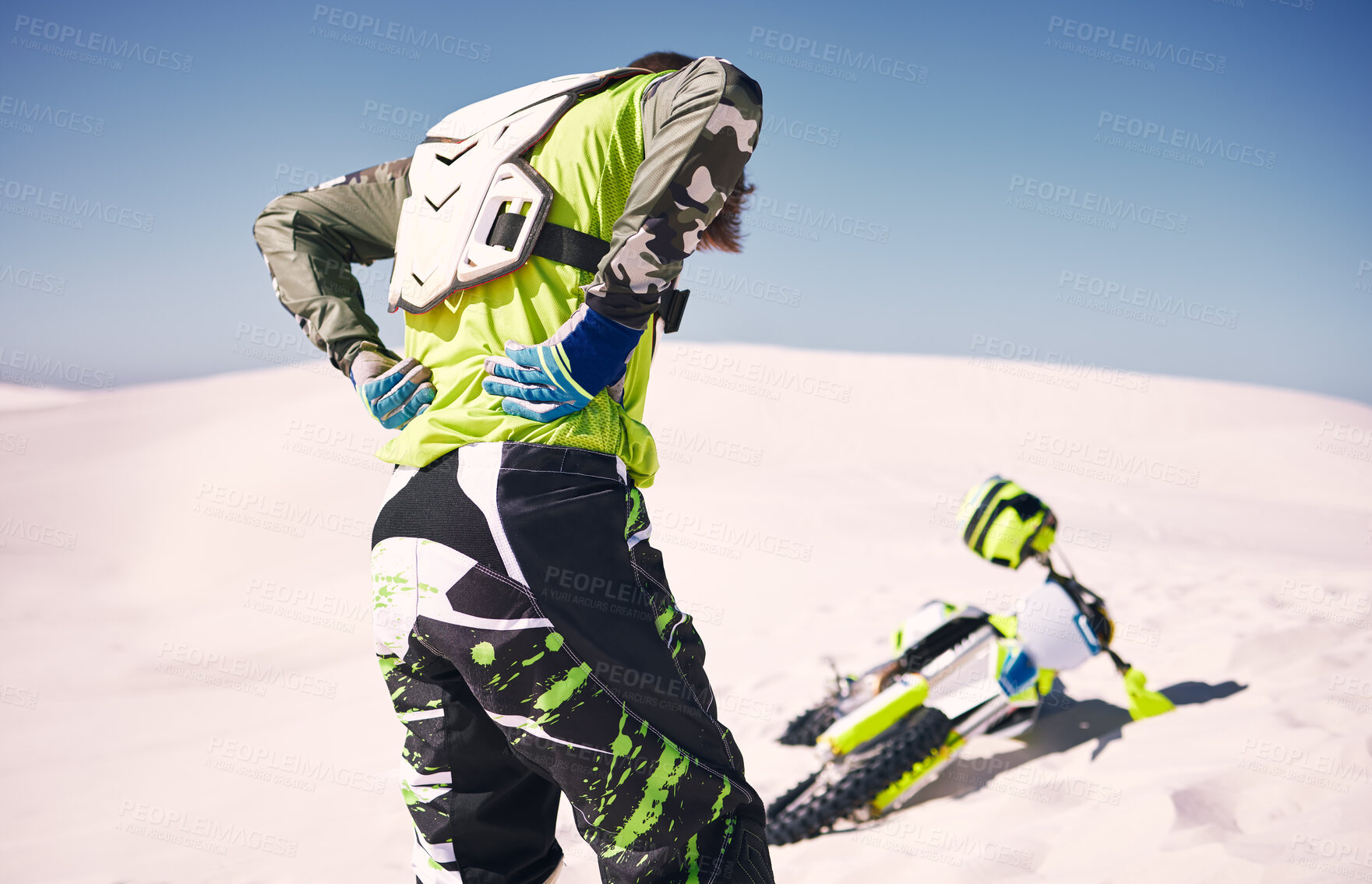 Buy stock photo Motorcycle, accident and back pain of man with motorbike, sports and race injury in the dessert. Athlete, risk and emergency outdoor with muscle, medical and health problem after crash from ride