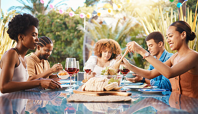 Buy stock photo Friends at lunch, party in garden and happy event with diversity, food and wine for bonding together. Outdoor dinner, men and women at table, group of people eating with drinks in backyard in summer.