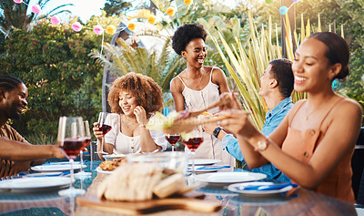 Buy stock photo Group of friends at lunch, party in garden with smile, eating and happy event with diversity. Outdoor dinner, men and women at table with food, wine and talking together in backyard with celebration.