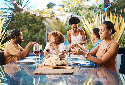 Buy stock photo Friends, food and celebration, lunch in garden and happy event with diversity, conversation and wine. Outdoor dinner, men and women at table, group of people eating with drinks in backyard in summer.