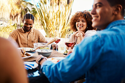 Buy stock photo Happy, friends and lunch in a garden together for conversation, eating and bonding at a table. Smile, laughing and diversity of a woman and men in a backyard with food, conversation or dinner