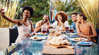 Selfie, group of friends at lunch in garden and party at table with diversity, food and wine together. Photography, men and women at dinner party table, happy people eating with drinks in backyard.