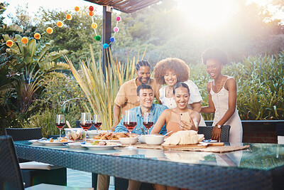 Buy stock photo Selfie, group of friends at dinner in garden and happy event with diversity, food and wine at outdoor party. Photography, men and women at table, fun people with drinks in backyard at sunset together