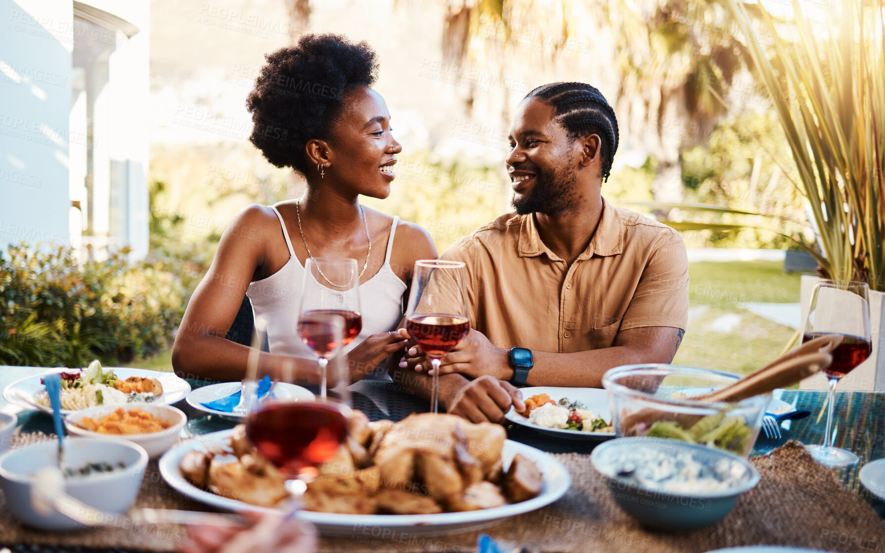 Buy stock photo Love, outdoor and black couple with lunch, smile and marriage with celebration, relationship and bonding. Romance, African man or happy woman with meal, food and relax with happiness, chat and eating