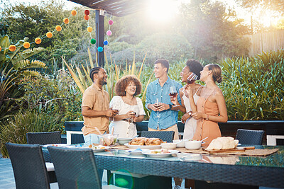 Buy stock photo Conversation, group of friends at dinner in garden at party and celebration with diversity, food and wine at outdoor lunch. Chat, men and women at table, fun people with drinks in backyard together.
