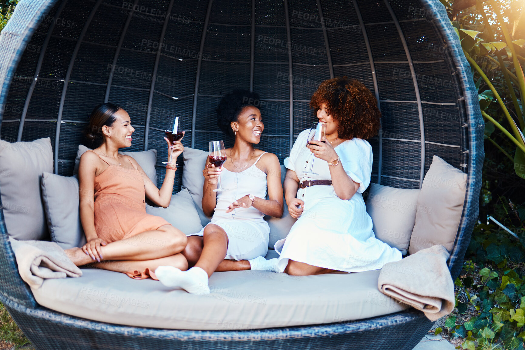 Buy stock photo Travel, luxury and friends on vacation in conversation happy for an outdoor getaway together with alcohol. Wine, laughing and people on holiday in nature bonding in happiness in a modern tent