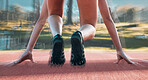 Start, running and sports with shoes of person on race track for fitness, speed and marathon training. Competition, health and workout with closeup of runner in stadium for energy and performance