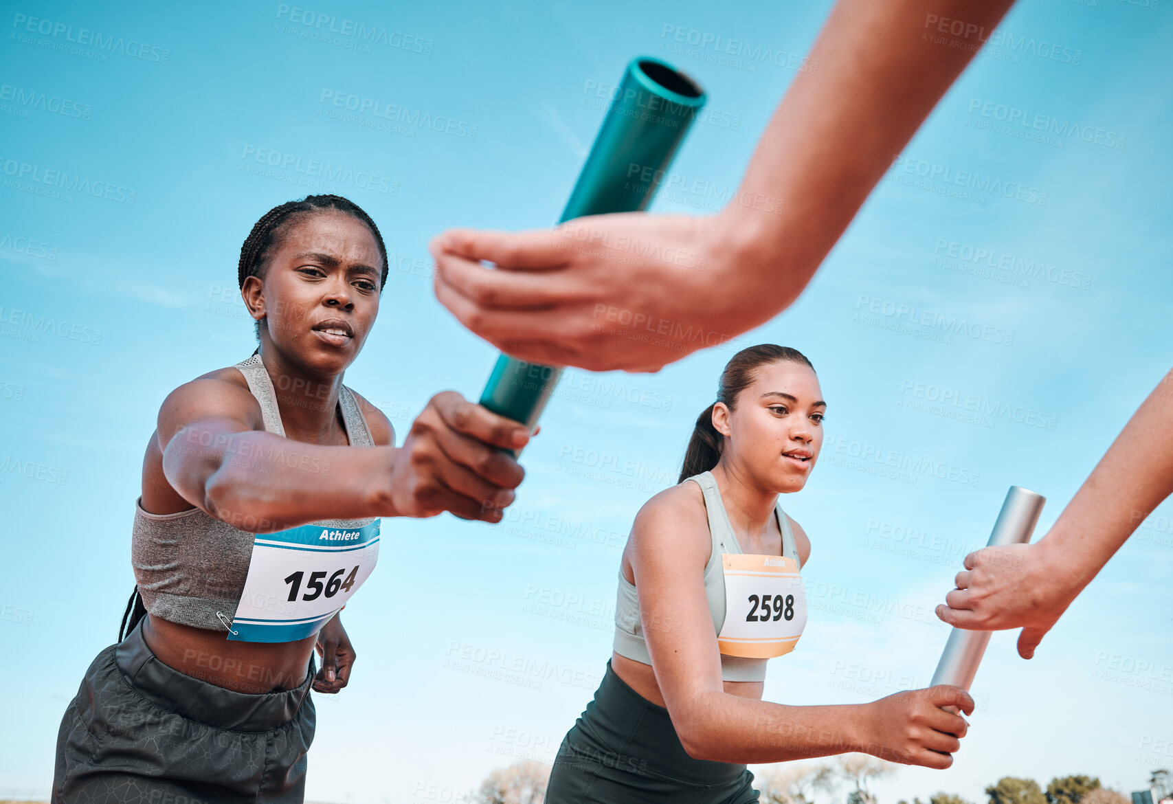 Buy stock photo Woman, teamwork and baton in relay, running competition or sports fitness on stadium track. Active people or athlete passing bar in competitive race, sprint or coordination for team performance