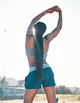 Stretching, exercise and sports woman outdoor at a stadium for workout, training and warm up. Back of athlete person for muscle stretch, fitness and wellness or flexibility for a run or competition