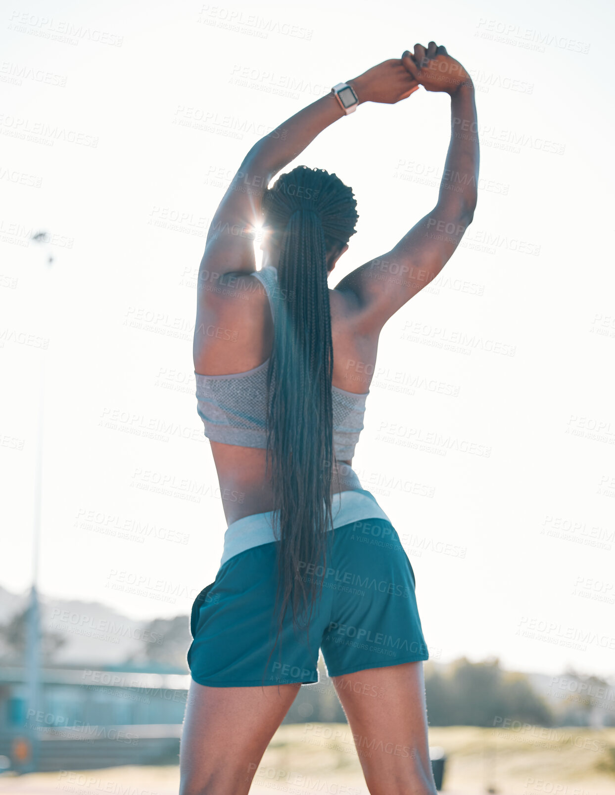 Buy stock photo Stretching, exercise and sports woman outdoor at a stadium for workout, training and warm up. Back of athlete person for muscle stretch, fitness and wellness or flexibility for a run or competition