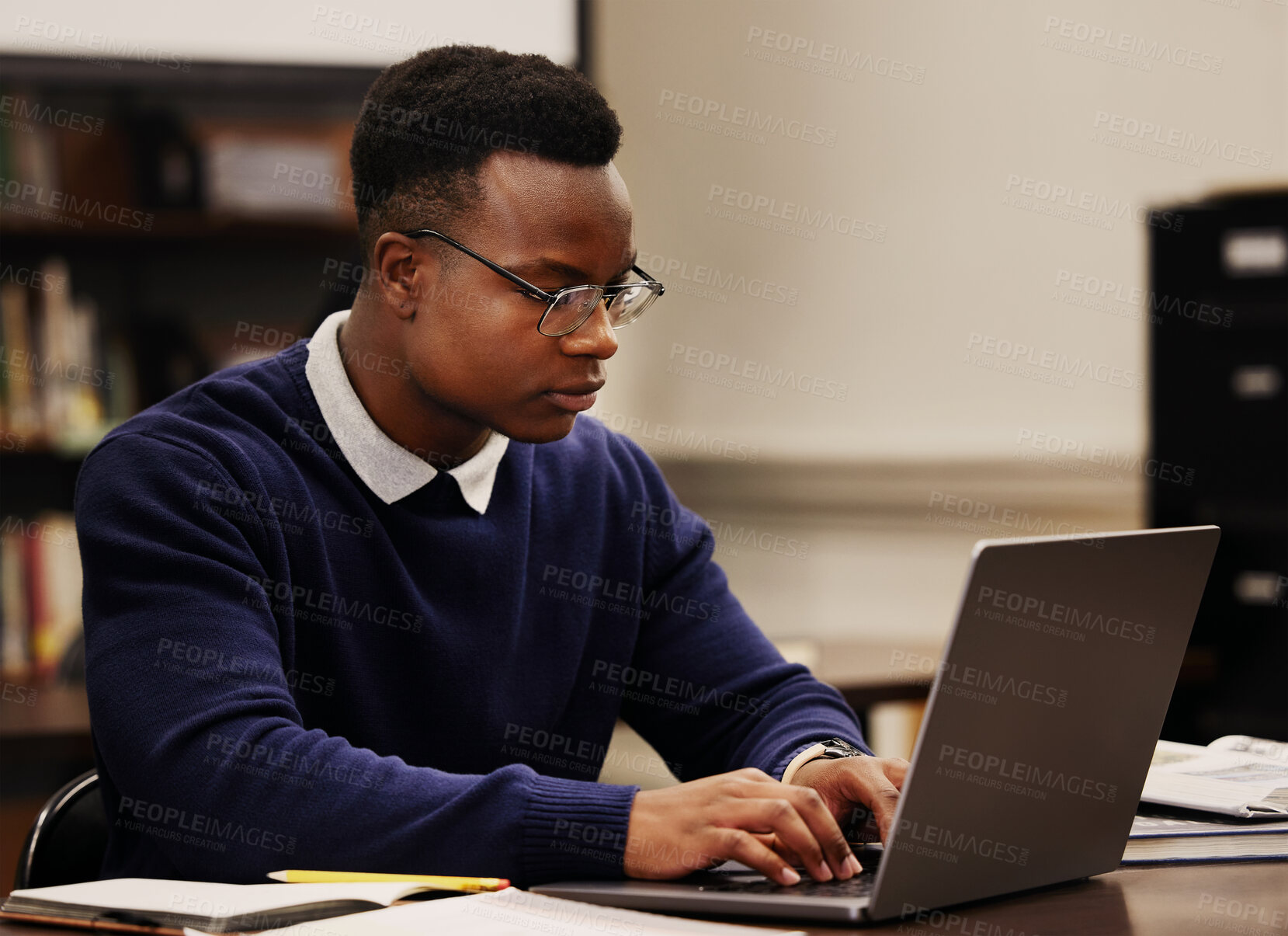 Buy stock photo Student, learning and black man typing on a laptop in university or college campus working on assignment project. Online, studying and young person prepare for internet exam or doing research 