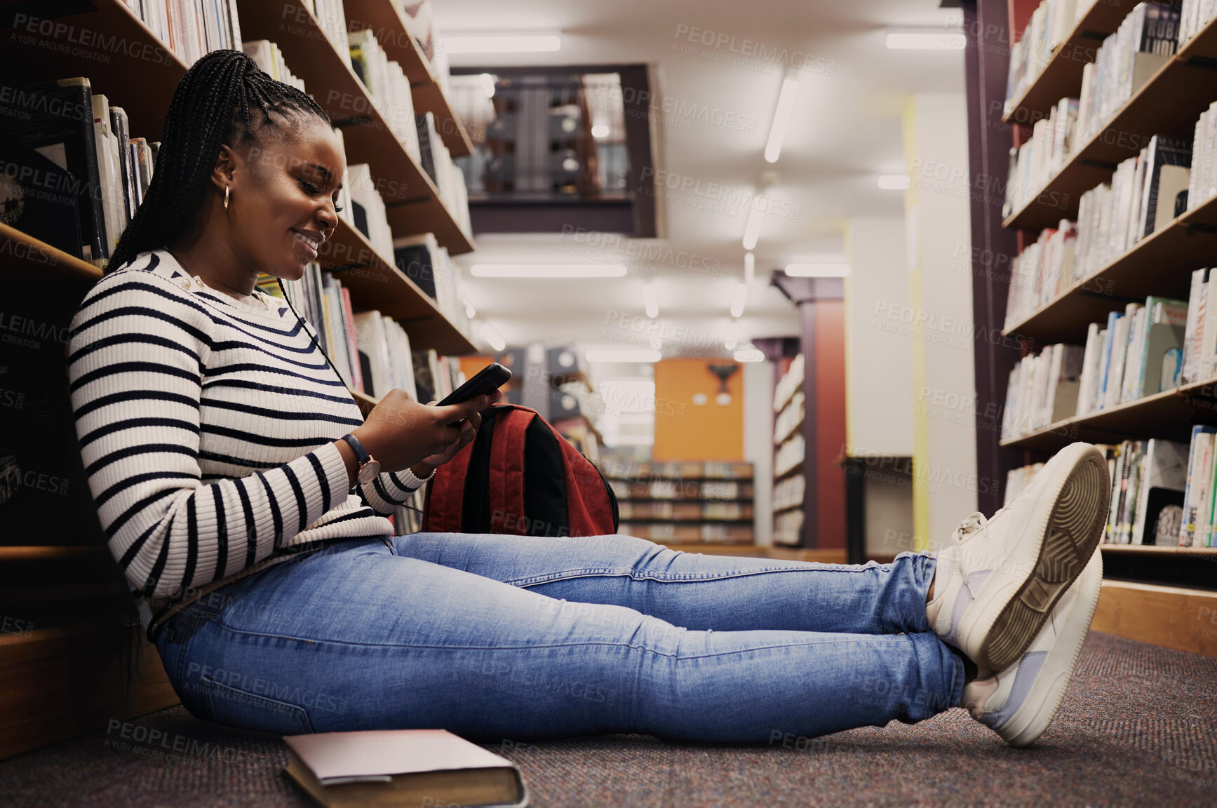 Buy stock photo Student, library and woman reading with phone for research, information or browsing internet website, social media or blog. College, campus and girl on smartphone for communication or knowledge