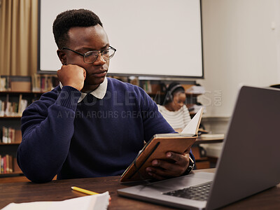 Buy stock photo University, education and black man student reading and learning in a college for knowledge development. Serious, books and person studying research to prepare for exam or assignment in a class