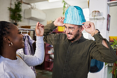Buy stock photo Shopping, couple and a man with a hat for fashion at a retail store with clothes or sale. A man and woman together in a shop or a happy customer with product choice in a boutique or mall with a smile