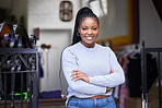 Happy black woman, portrait and arms crossed in clothes store, thrift shop or fashion workshop in owner pride. Smile, confident and professional designer in small business or retail donation industry