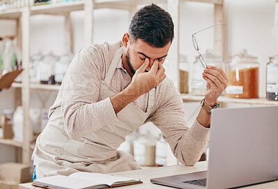 Buy stock photo Store, laptop and man with a headache, stress and burnout with financial crisis, tired and overworked. Fatigue, entrepreneur and business owner with a pc, migraine and online shop management fail