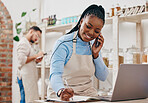 Black woman, cashier notes and phone call with networking and inventory check for retail store. Happy, shop management and mobile with communication and discussion about business and supply chain