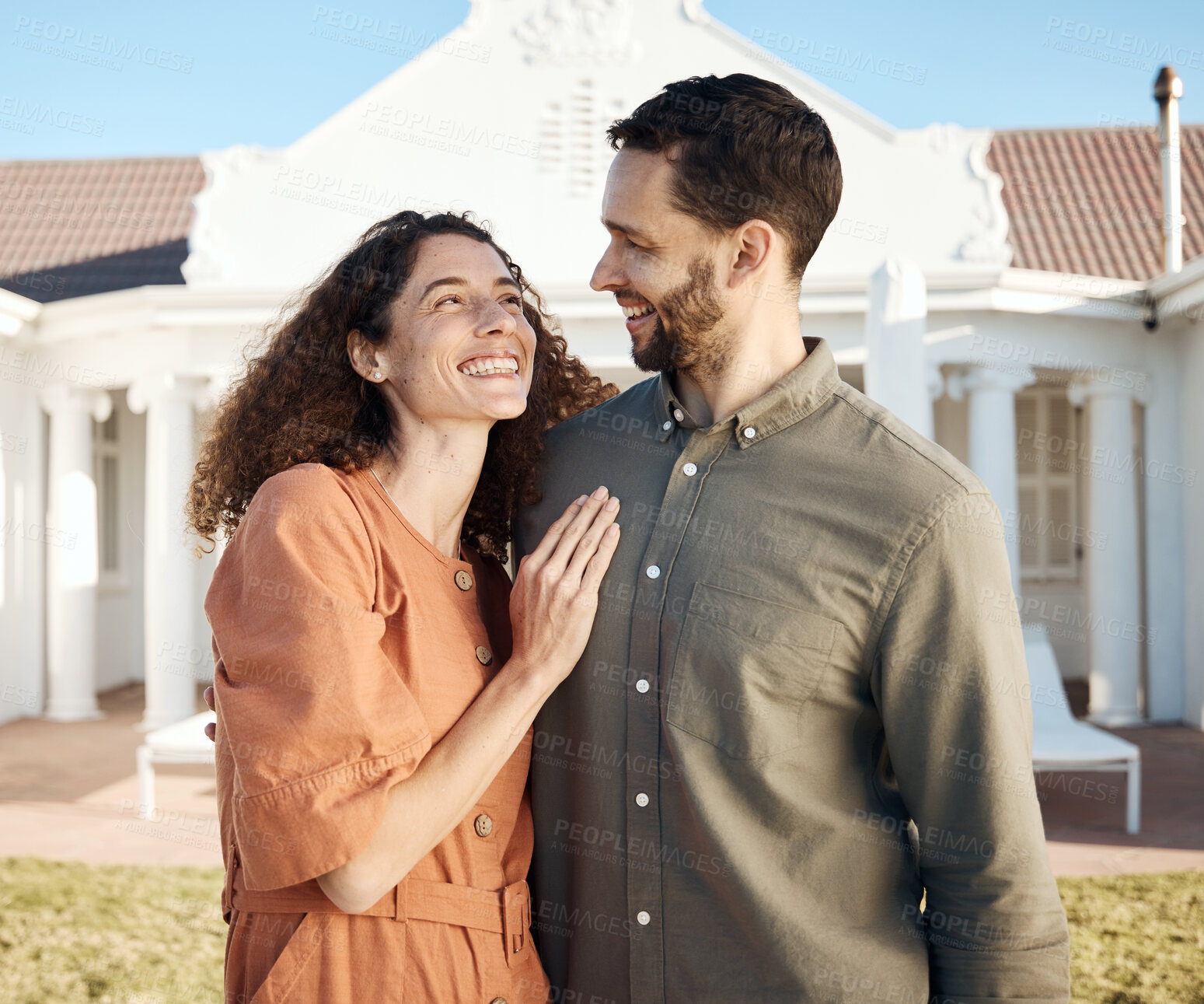 Buy stock photo Happy, couple and hug outdoor of new house, real estate and moving to residential property for rental. Man, woman and homeowner smile in garden for investment, mortgage finance and dream neighborhood