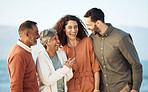 Funny, happy and vacation with big family at beach for summer travels, care and support. Love, smile and happiness with senior parents and couple laughing in nature for holiday, relax and bonding