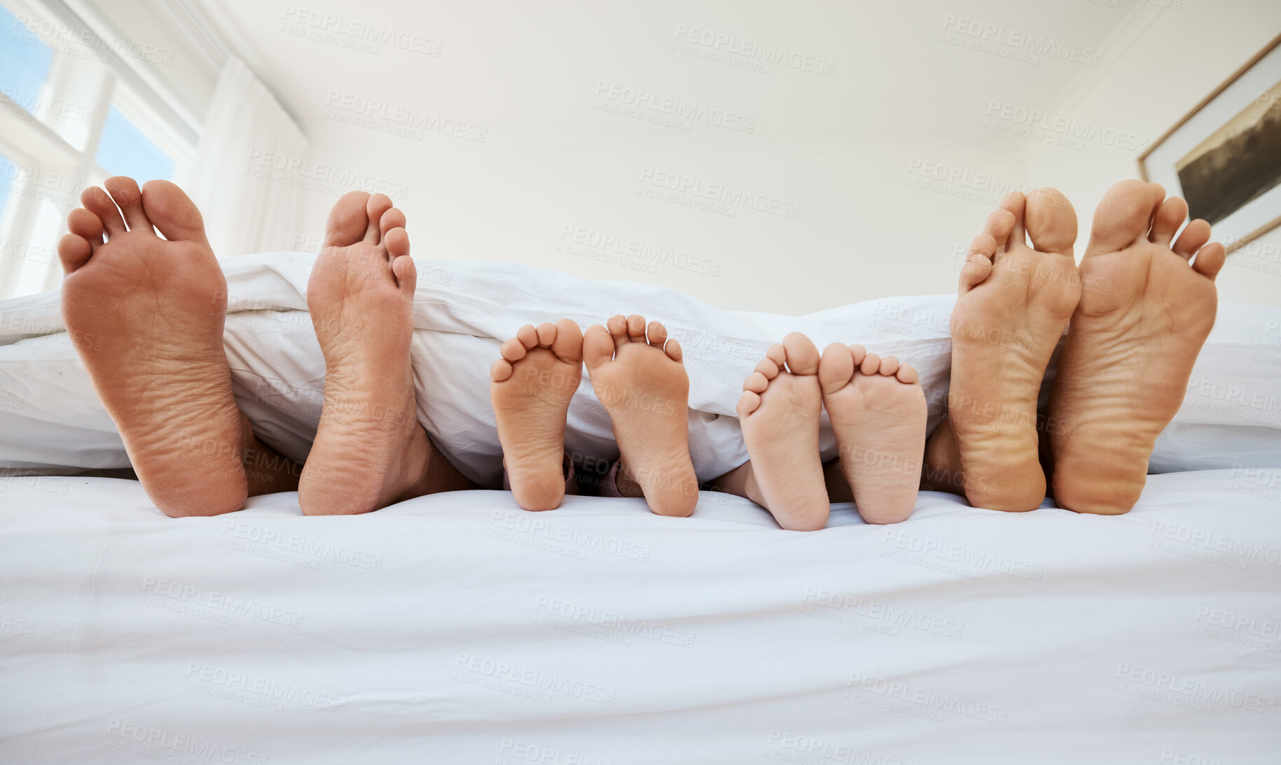 Buy stock photo Family, feet and sleeping in bed in home, relax in peace and rest in morning blanket together. Barefoot, bedroom and father, mother and children with parents in comfort, bonding and care in house