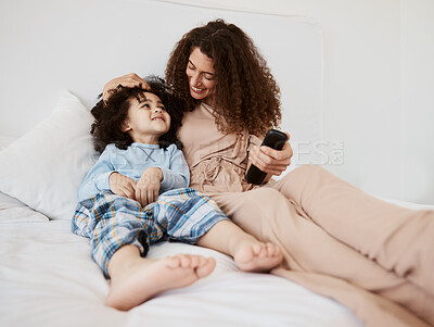 Buy stock photo Bed, happy family child and mom watching tv series, movie and bonding with son, connect and enjoy relax morning. Bedroom, kid and home mother watch cartoon show, television or media entertainment