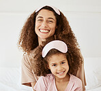 Mother, daughter and sleep mask, happiness in portrait and bonding with love and care in the morning. Woman, young girl and smile at home, pajamas and family, positivity and fun together in bedroom