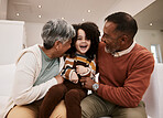 Grandparents' love, laugh and happy family child, grandma and grandfather excited, having home fun and babysitting grandchild. Comedy humour, grandfather and grandmother play with kid on lounge sofa