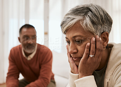 Buy stock photo Divorce, crisis and senior couple on sofa with problem, fail or angry, argument or dispute at home. Marriage, stress and annoyed man with woman in living room for depression, abuse or cheating guilt