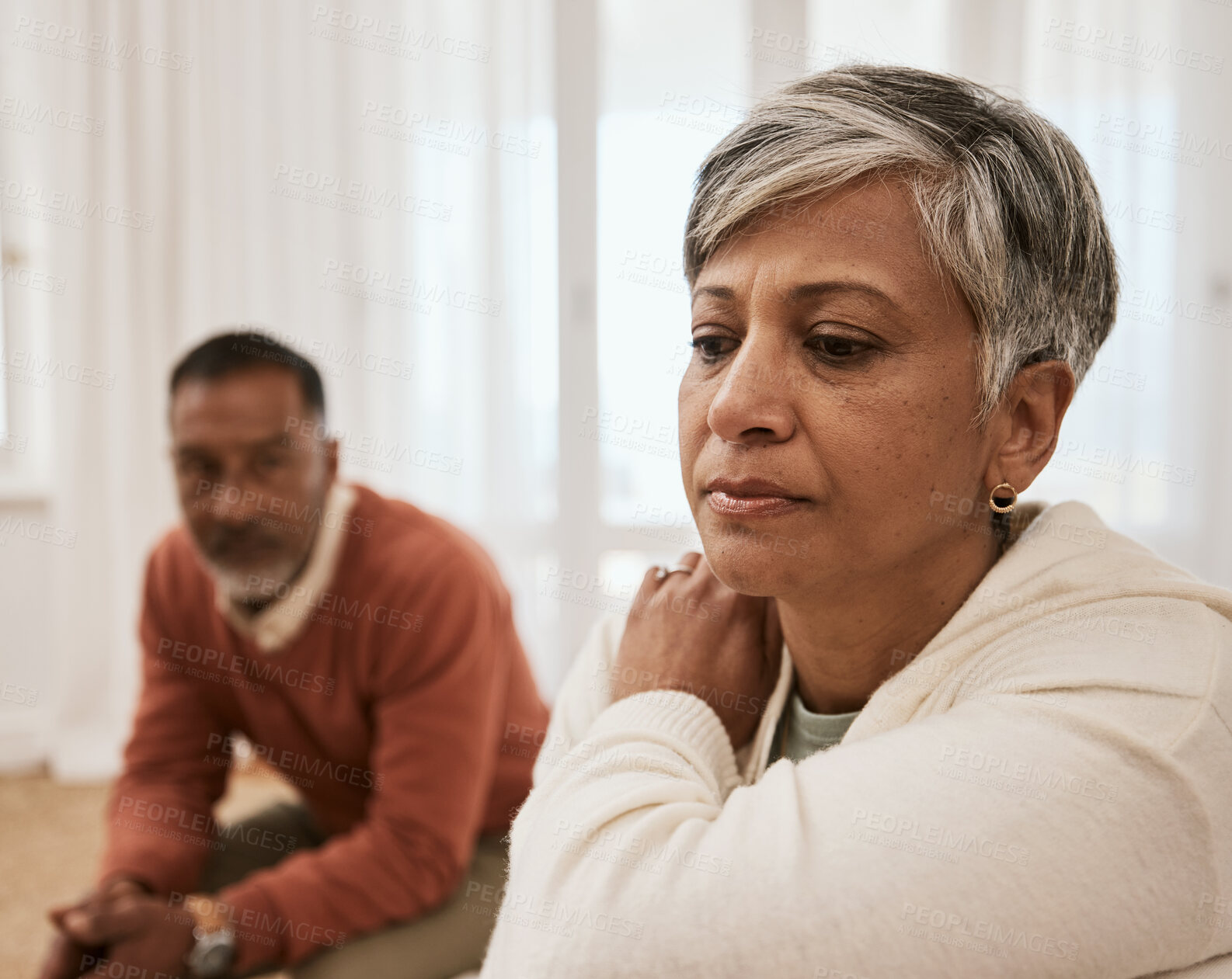 Buy stock photo Senior, frustrated and couple in fight, divorce or argument in conflict, dispute or disagreement on sofa. Mature man and woman in toxic relationship, marriage or breakup from cheating affair at home