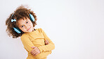 Portrait, music headphones and kid arms crossed in studio isolated on a white background mockup space. Face, confidence and girl child on radio listening to podcast, streaming audio and hearing sound