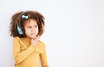 Thinking, problem and child with headphones on white background for planning, solution or music. Mockup, stress and a girl kid with a podcast, radio or audio idea with space for listening information