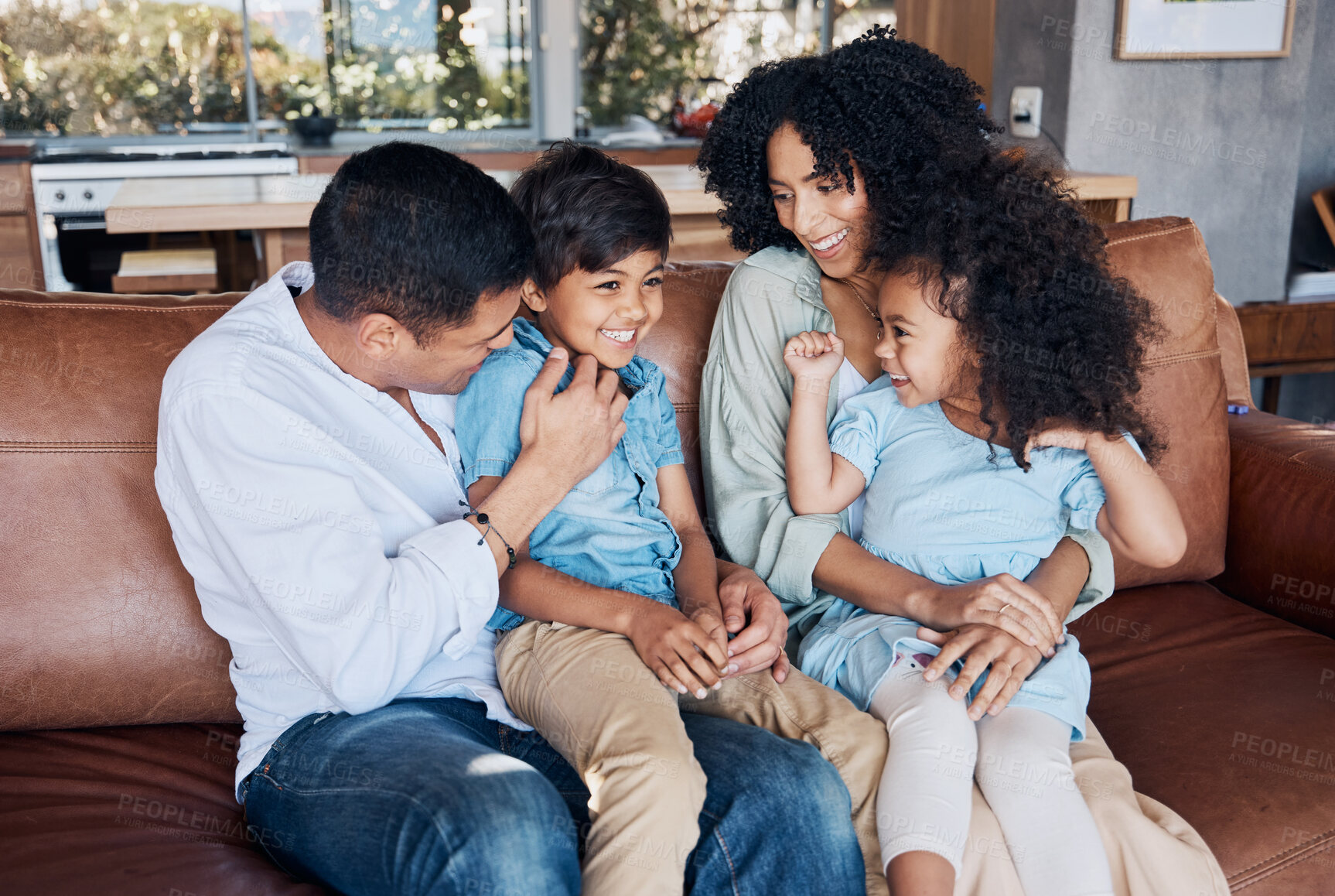 Buy stock photo Happy, funny and relax with family on sofa for smile, bonding and peace on holiday. Love, care and happiness with parents and children in living room at home for vacation, cuddle and embrace together