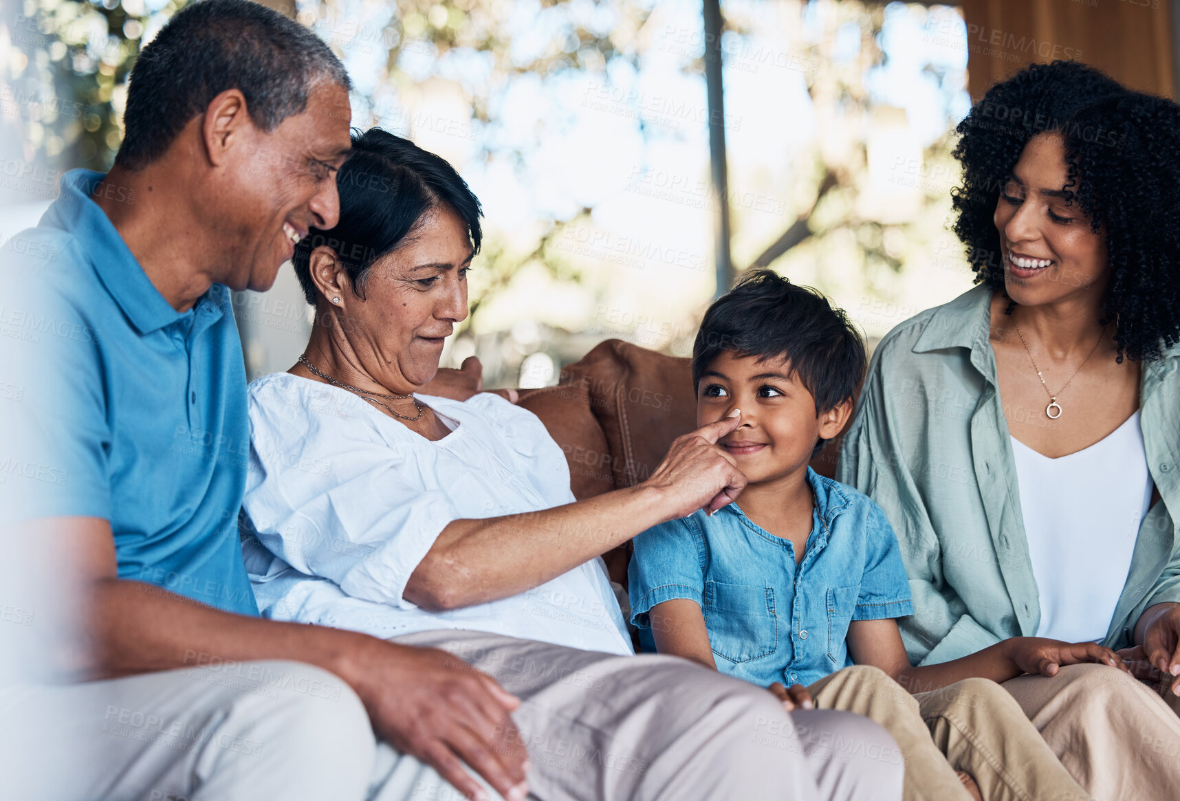 Buy stock photo Big family, living room and bonding fun at home with parent love, support and care on a sofa. Parents, grandparents and kid together in a lounge relax with grandmother, child and mother with a smile