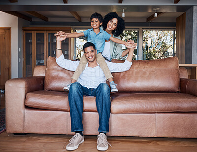 Buy stock photo Happy, airplane and portrait with family on sofa for smile, bonding and peace on holiday. Love, care and happiness with parents and child in living room at home for vacation, cuddle and embrace