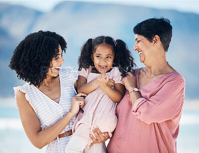 Buy stock photo Happy family, hug and girl with mother and grandmother at the beach with freedom, fun and bond in nature. Love, smile and child with mom and grandma at sea for travel, vacation or ocean trip in Miami