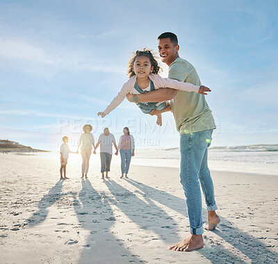 Buy stock photo Dad, girl and family at beach, airplane game and portrait with smile, bonding and love in summer sunshine on vacation. People, father and flying daughter, happy and swinging in air, ocean and holiday