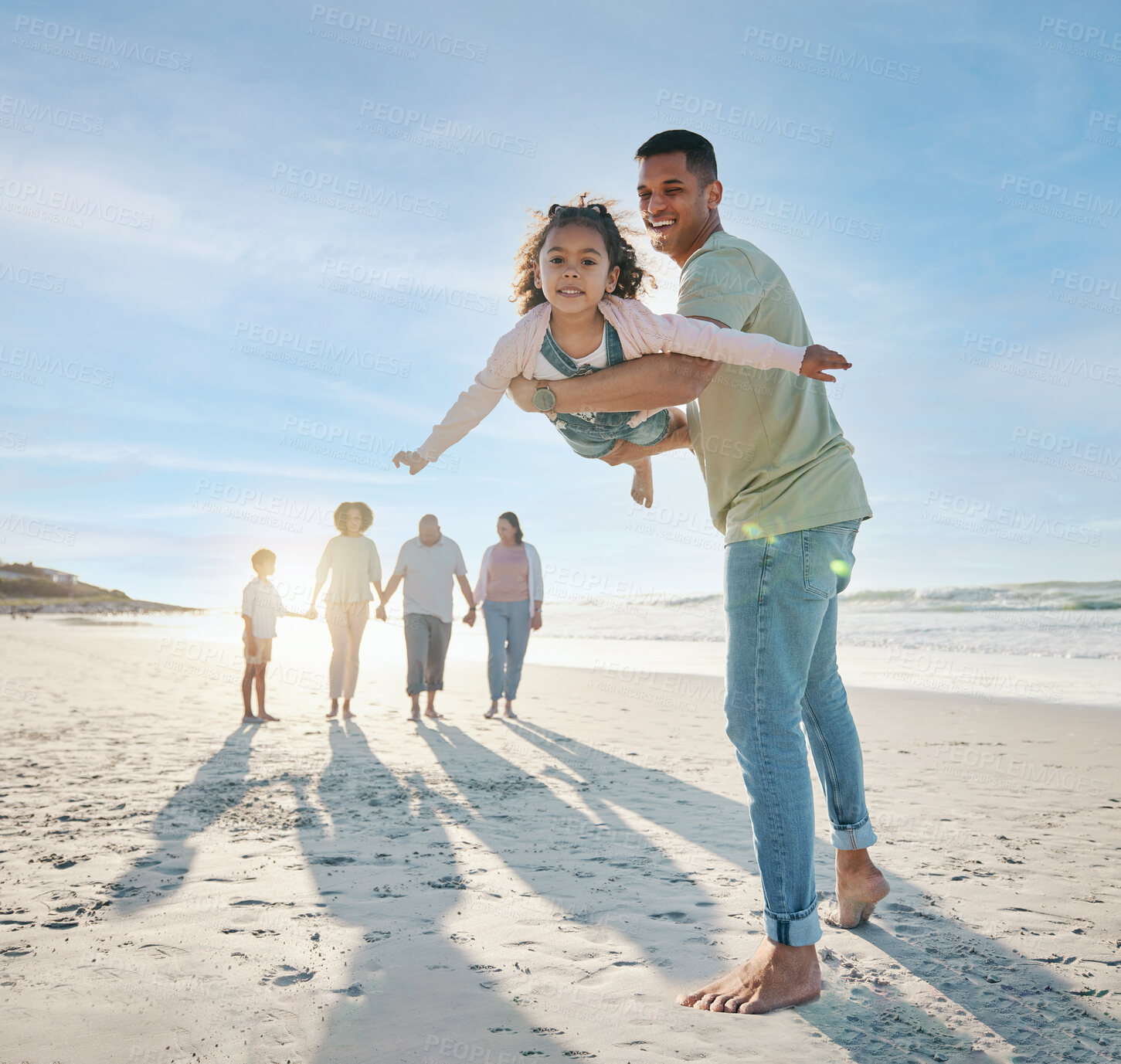 Buy stock photo Dad, girl and family at beach, airplane game and portrait with smile, bonding and love in summer sunshine on vacation. People, father and flying daughter, happy and swinging in air, ocean and holiday