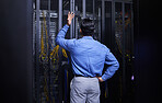 Server room, stress or technician with hardware or cables for cybersecurity glitch or machine problem. Doubt, man or back of confused engineer fixing network for information technology support