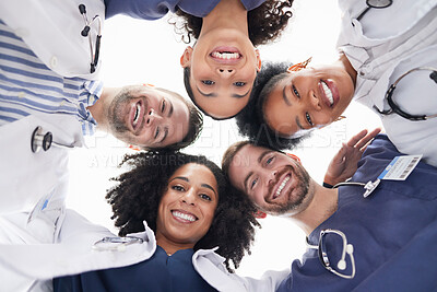 Buy stock photo Happy people, portrait and doctors in huddle, teamwork or unity in healthcare mission together below. Low angle of excited group of medical professionals smile in team building, support or goals