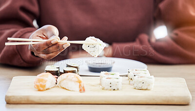 Buy stock photo Sushi, seafood and brunch with hands of person in store for restaurant, Japanese cuisine and menu. Fish, salmon and health with closeup of customer eating for nutrition, Asian diet and fine dining