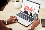 Woman, hands and laptop with credit card in online shopping, payment or banking on fashion at office. Closeup of female person with debit on computer in ecommerce, buying or fintech at the workplace
