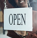 Store, window or open sign by happy woman for small business, startup or restaurant poster advertising. Coffee shop, notice or manager with glass billboard news for cafe, service or entrepreneurship 