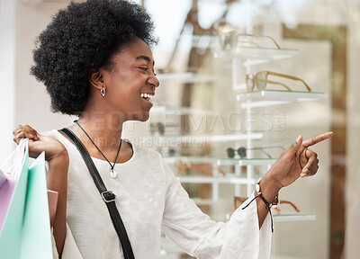 Buy stock photo Customer, shopping and black woman with a choice, sale and retail with luxury, optometry store and happiness. Client, shopper and African person buying glasses, discount deal and decision with spree