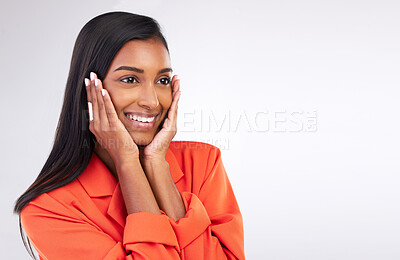 Buy stock photo Smile, excited and hands on woman face in studio shy for news, promo or announcement on white background. Happy, emoji and Indian female model with gossip, gesture or cute reaction while isolated