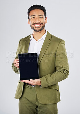 Buy stock photo Happy asian man, portrait and tablet mockup in advertising against a white studio background. Businessman with technology display or screen in marketing, advertisement or branding on mock up space