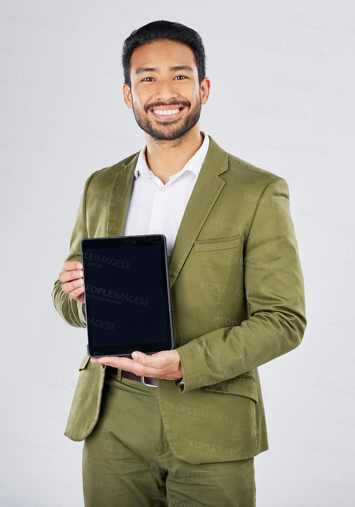Buy stock photo Happy asian man, portrait and tablet mockup in advertising against a white studio background. Businessman with technology display or screen in marketing, advertisement or branding on mock up space