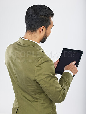 Buy stock photo Back, business and man with a tablet, career and professional on a white studio background. Japanese person, employee and accountant with tech, connection and data analysis with investment or trade